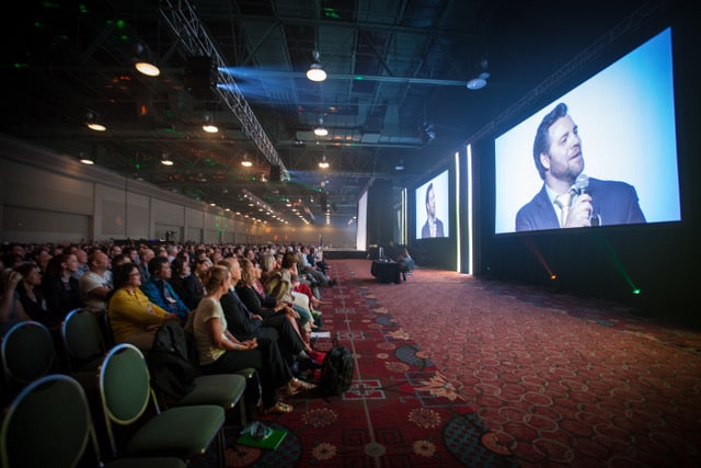 Jason on big screen in front of audience